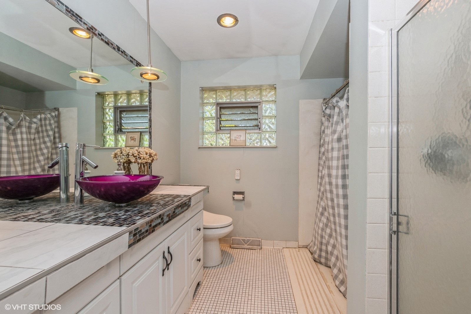 13011 South Shawnee Road Palos Heights, IL 60463 - Photo 21 of 28 a bathroom with a granite countertop toilet a sink and a mirror