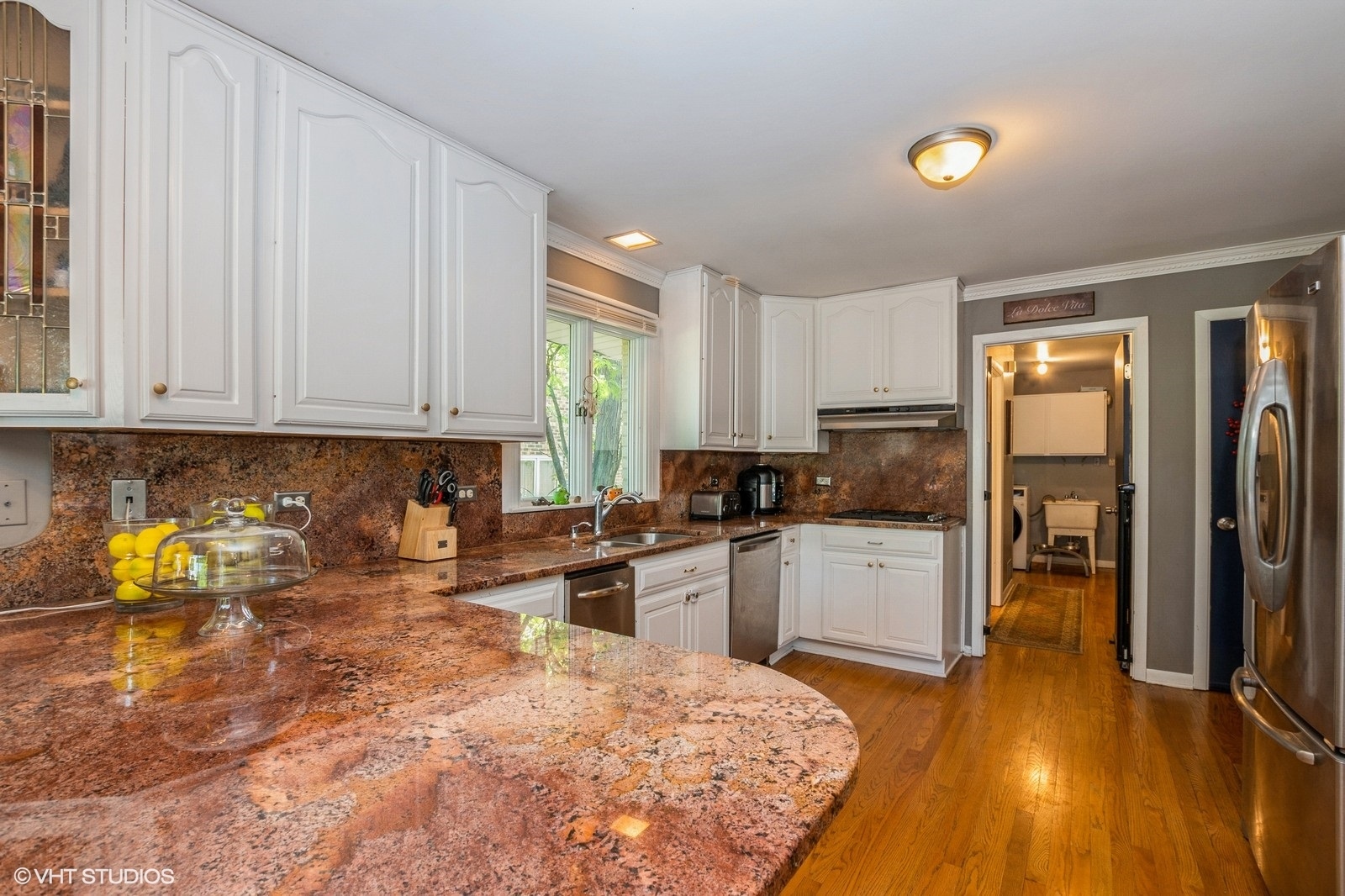 13011 South Shawnee Road Palos Heights, IL 60463 - Photo 7 of 28 a kitchen with a refrigerator and a stove top oven