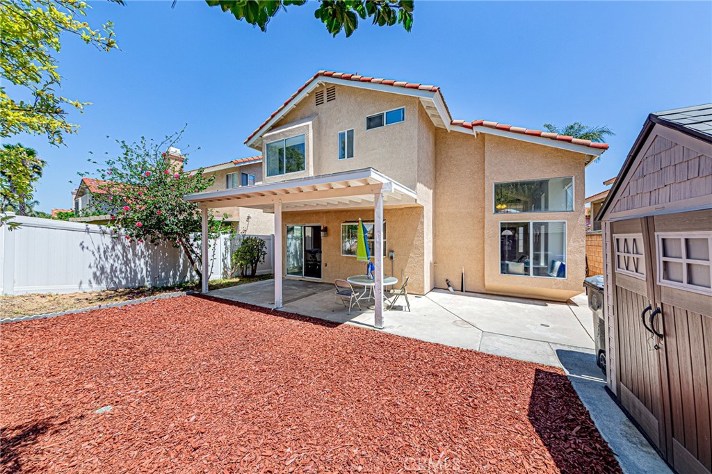 15377 Tobarra Road Fontana, CA 92337 - Photo 32 of 38 Backyard featuring a storage shed for added convenience