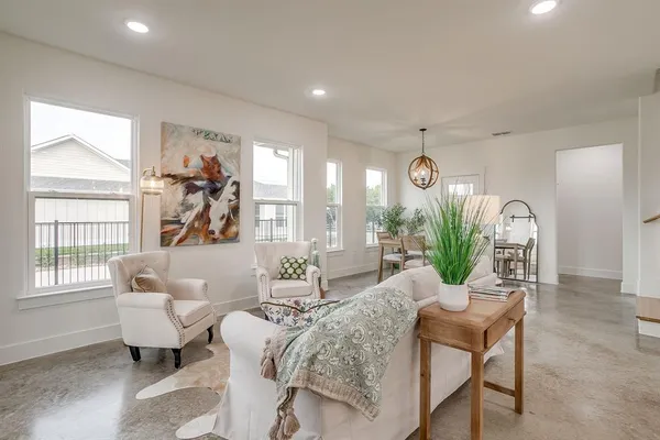a living room with furniture and a large window
