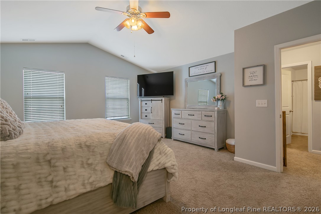 340 Battery Way Bunnlevel, NC 28323 - Photo 24 of 50 a bedroom with a bed and a television