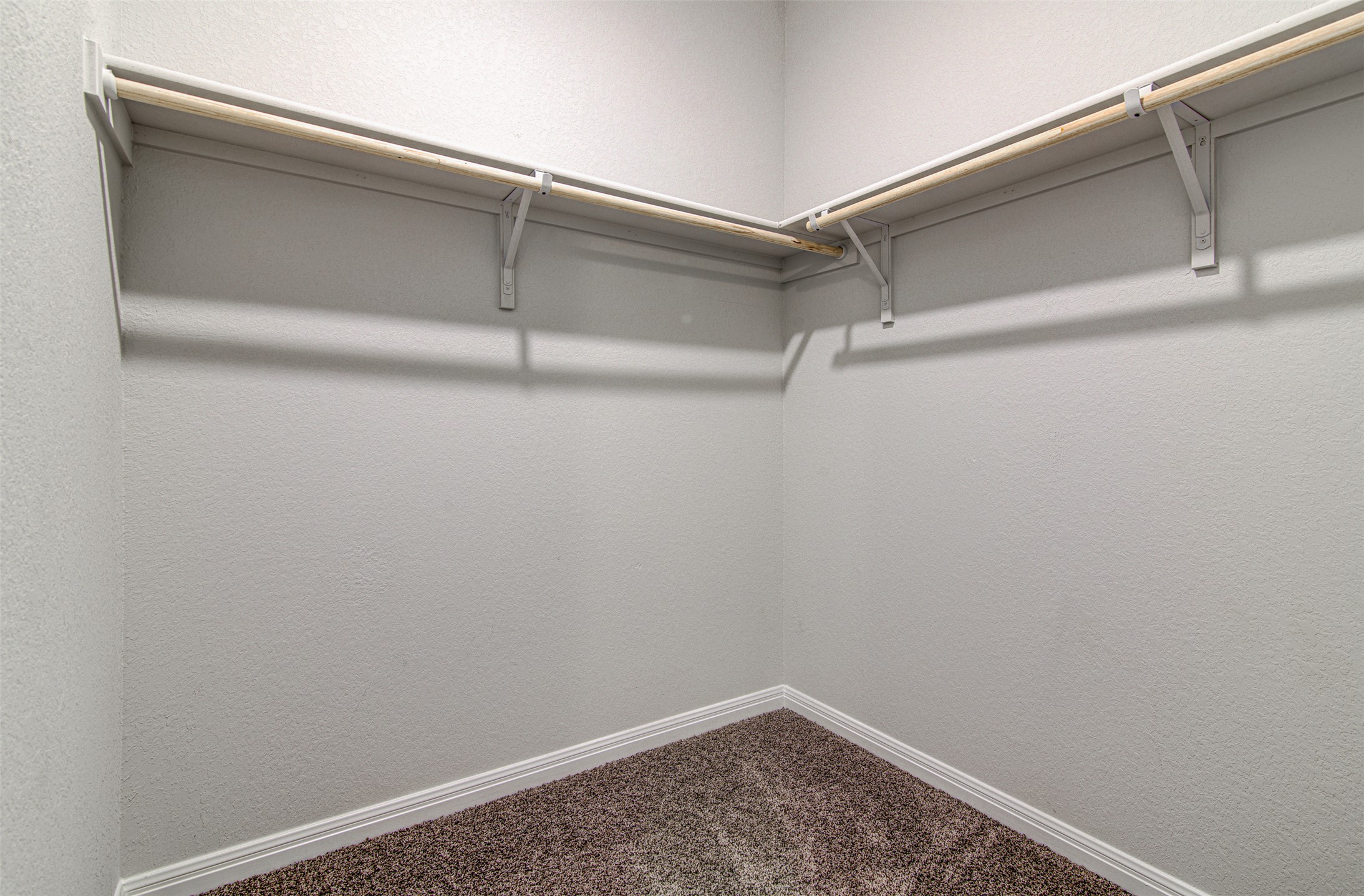 316 Pepper Mill Loop Burnet, TX 78611 - Photo 15 of 27 Functional and ready to organize, this walk-in closet offers ample hanging space.