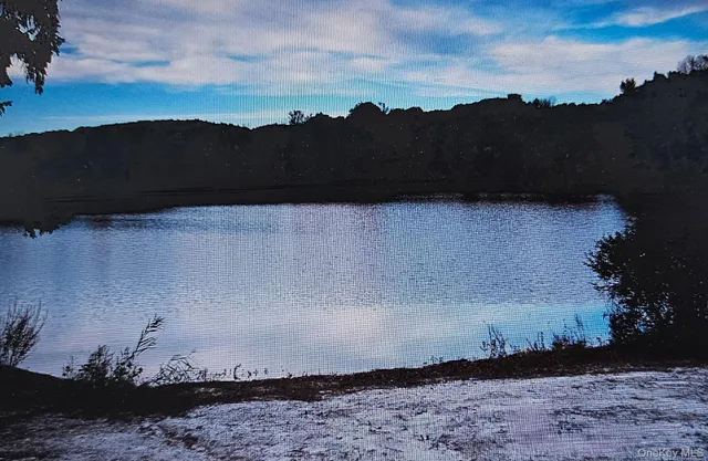 a view of a street with a mountain in the background