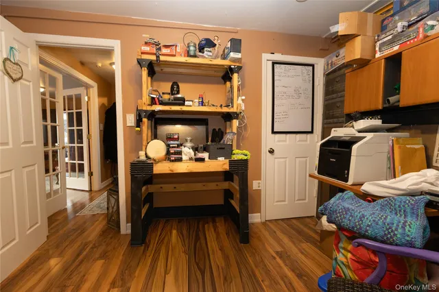 a view of a bedroom with baby crib and furniture