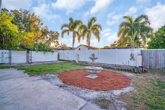 a backyard of a house with lots of green space