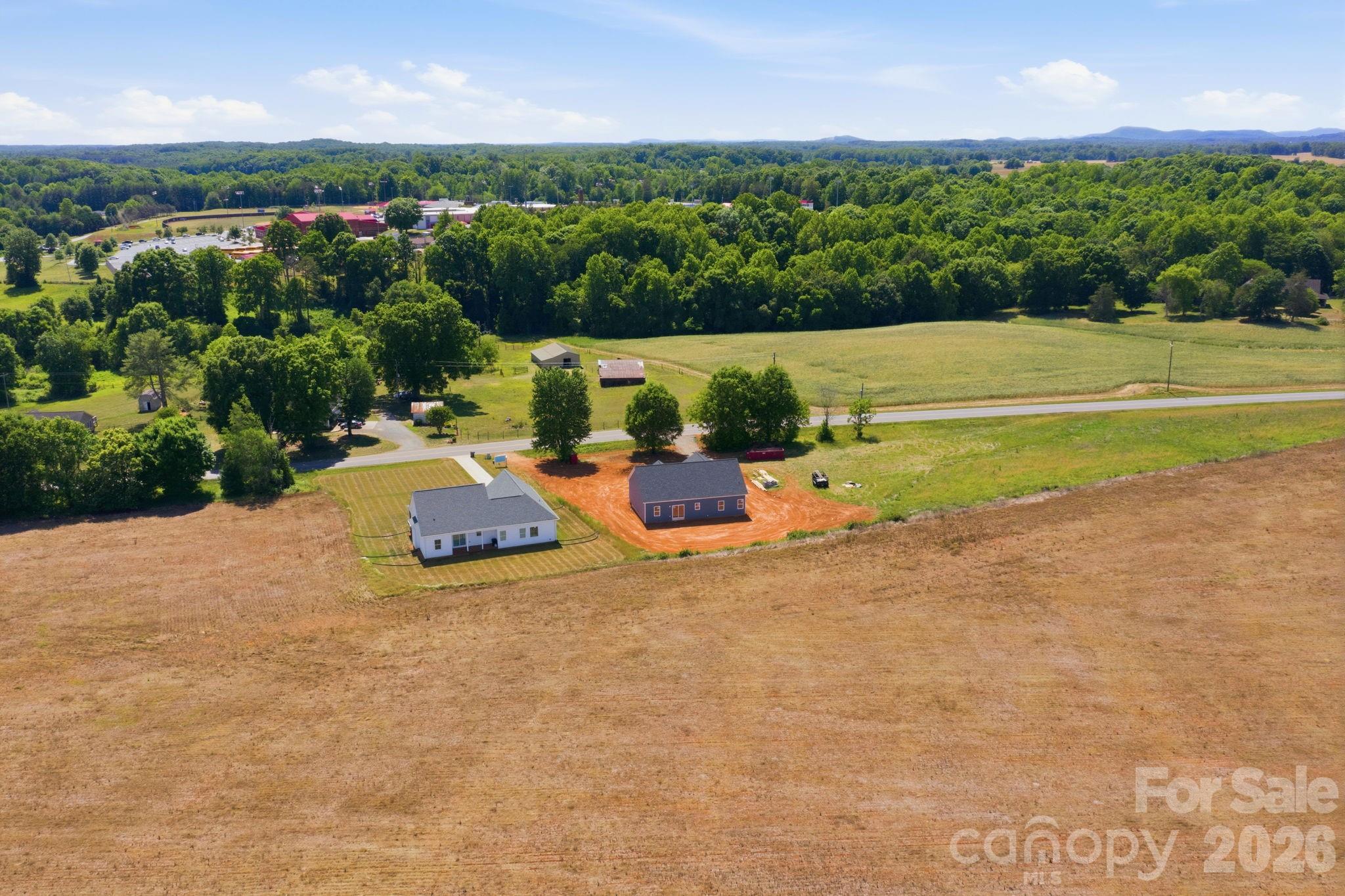 1720 Jennings Road Olin, NC 28660 - Photo 15 of 15 a view of a swimming pool with an outdoor space and seating area