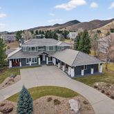 an aerial view of a house with a big yard