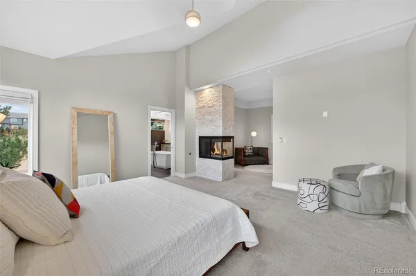 a spacious bedroom with a bed and window