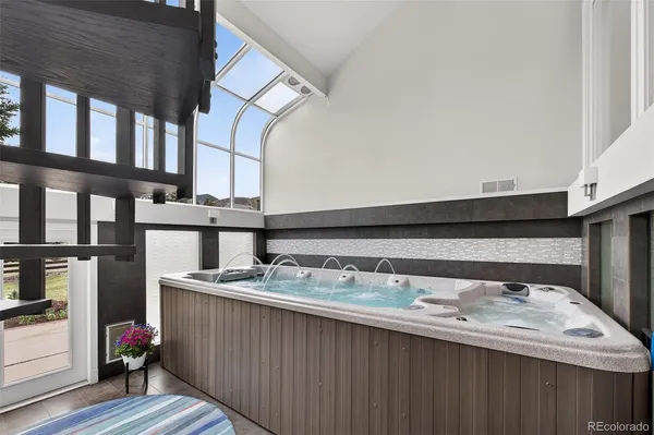 a balcony with beautiful flowers and wooden floor