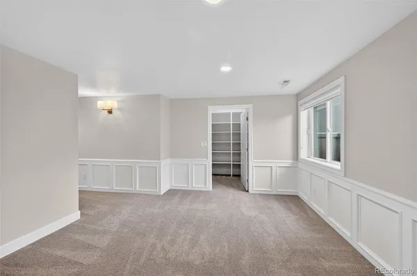 a view of a house with a wooden deck