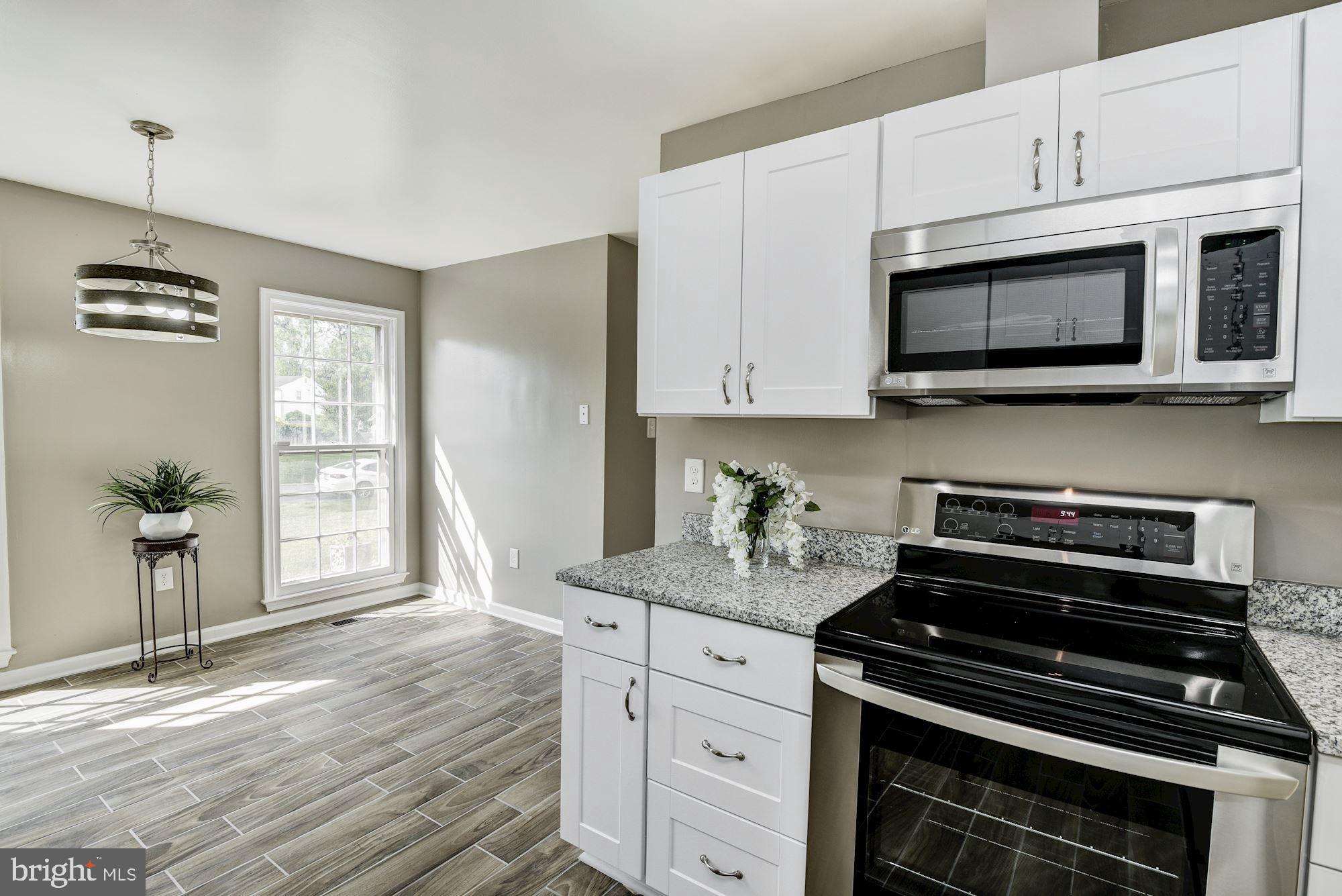 15020 Wellwood Road Silver Spring, MD 20905 - Photo 11 of 38 Built-in microwave.