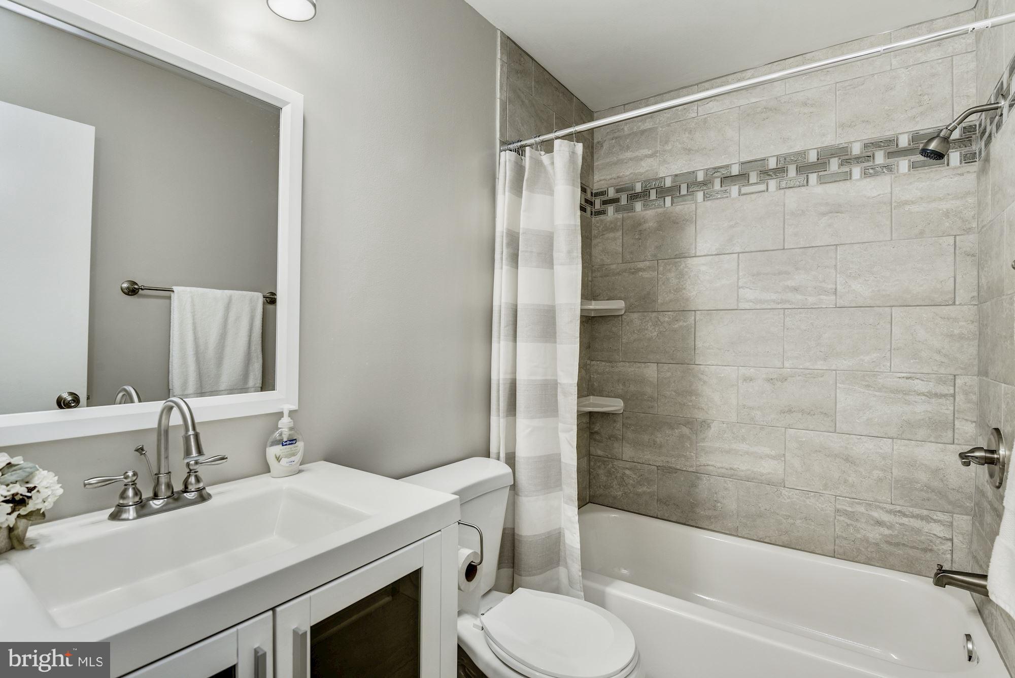 15020 Wellwood Road Silver Spring, MD 20905 - Photo 30 of 38 UL hall bath, renovated, tub and shower