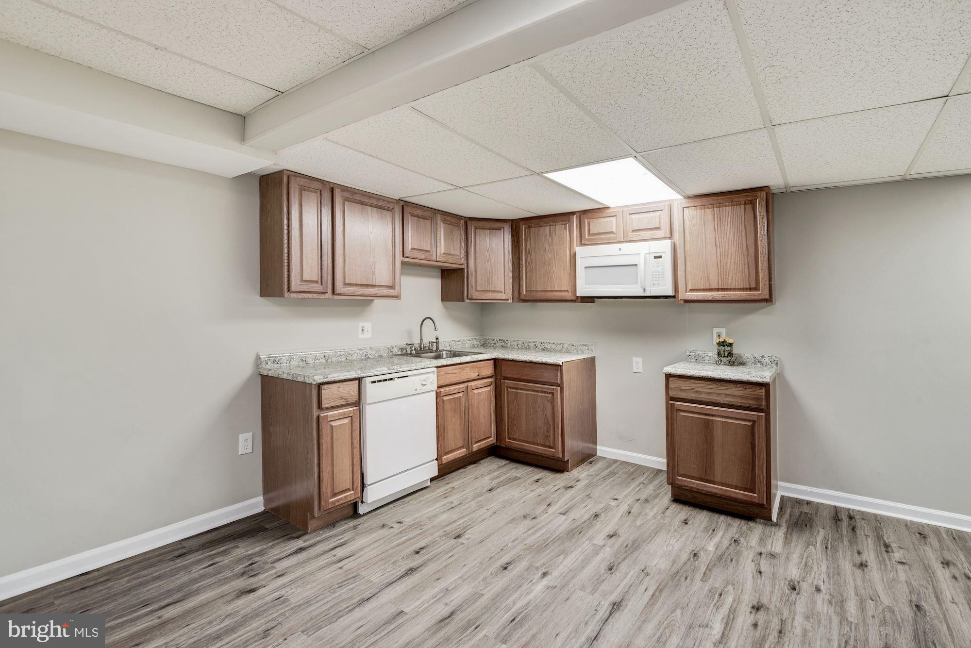 15020 Wellwood Road Silver Spring, MD 20905 - Photo 32 of 38 LVP floor, usable kitchen space