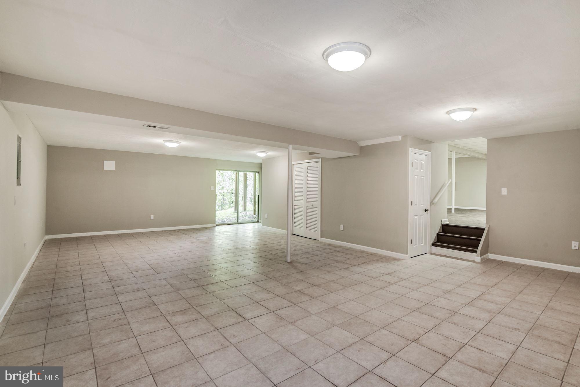 15020 Wellwood Road Silver Spring, MD 20905 - Photo 33 of 38 LL 2, tile floor, sliders to back
