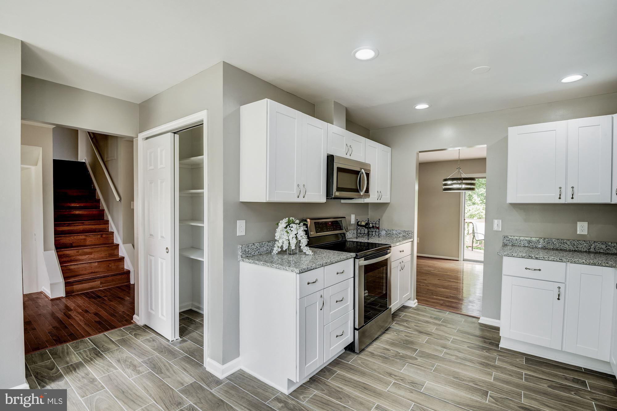 15020 Wellwood Road Silver Spring, MD 20905 - Photo 10 of 38 New cabinets, large pantry, great flow