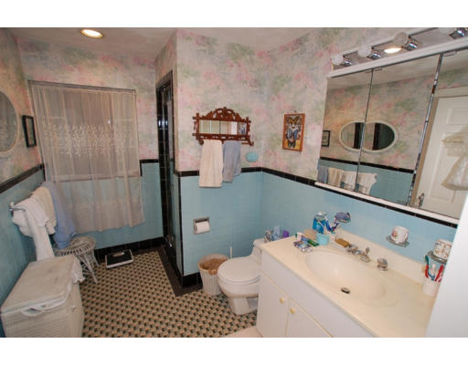 96 Pine Ridge Road Medford, MA 02155 - Photo 24 of 29 a bathroom with a sink mirror vanity and toilet