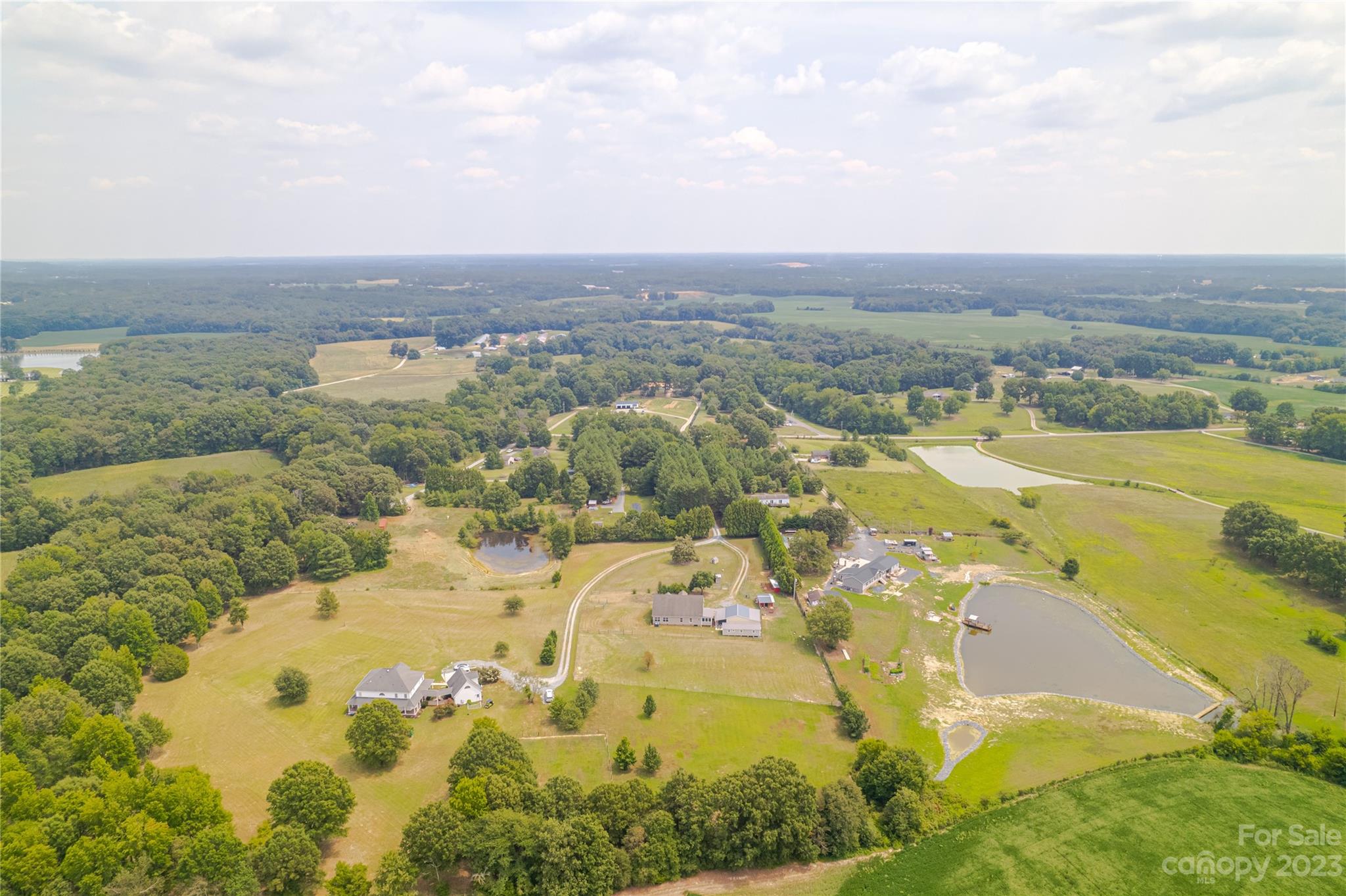 1131 Sikes Mill Road Monroe, NC 28110 - Photo 13 of 43 an aerial view of residential houses with outdoor space