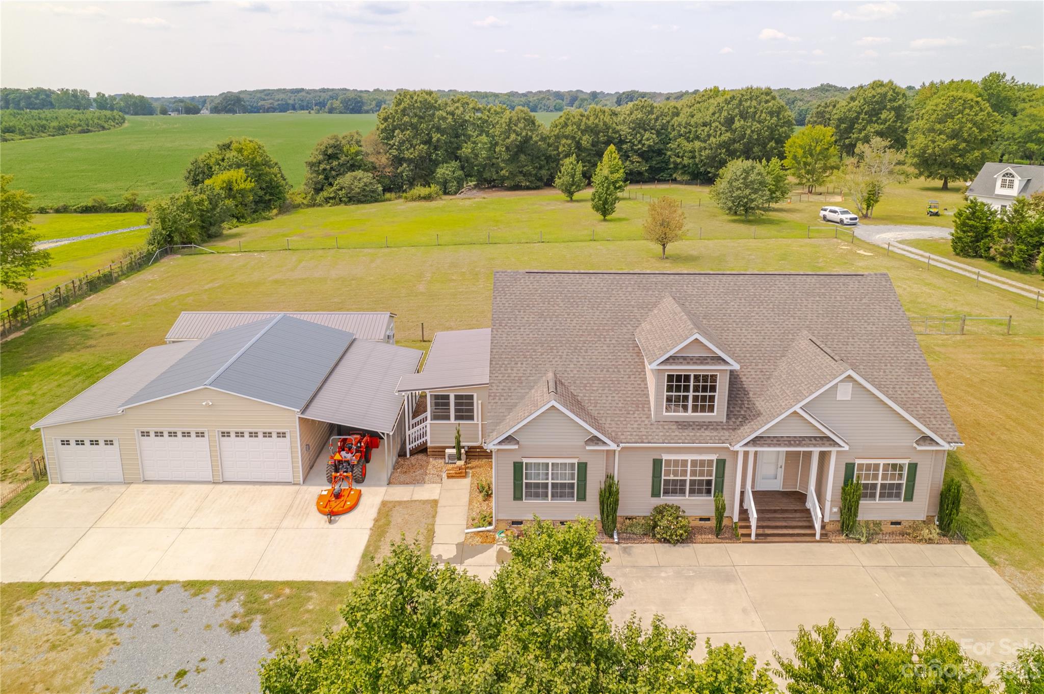 1131 Sikes Mill Road Monroe, NC 28110 - Photo 15 of 43 an aerial view of residential houses with outdoor space and ocean view