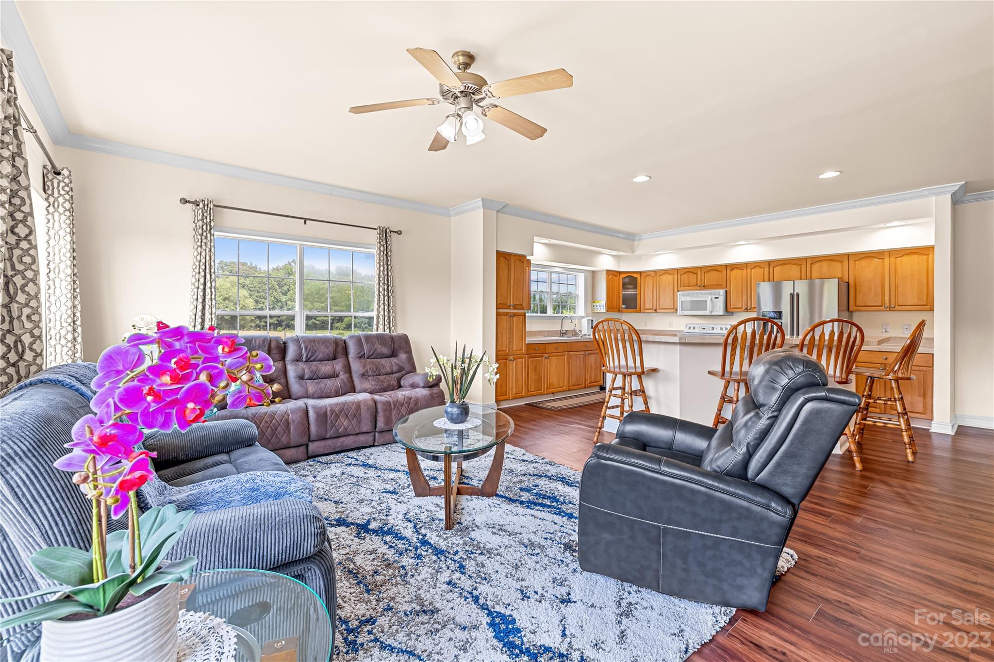 1131 Sikes Mill Road Monroe, NC 28110 - Photo 21 of 43 a living room with furniture or couch and a potted plant
