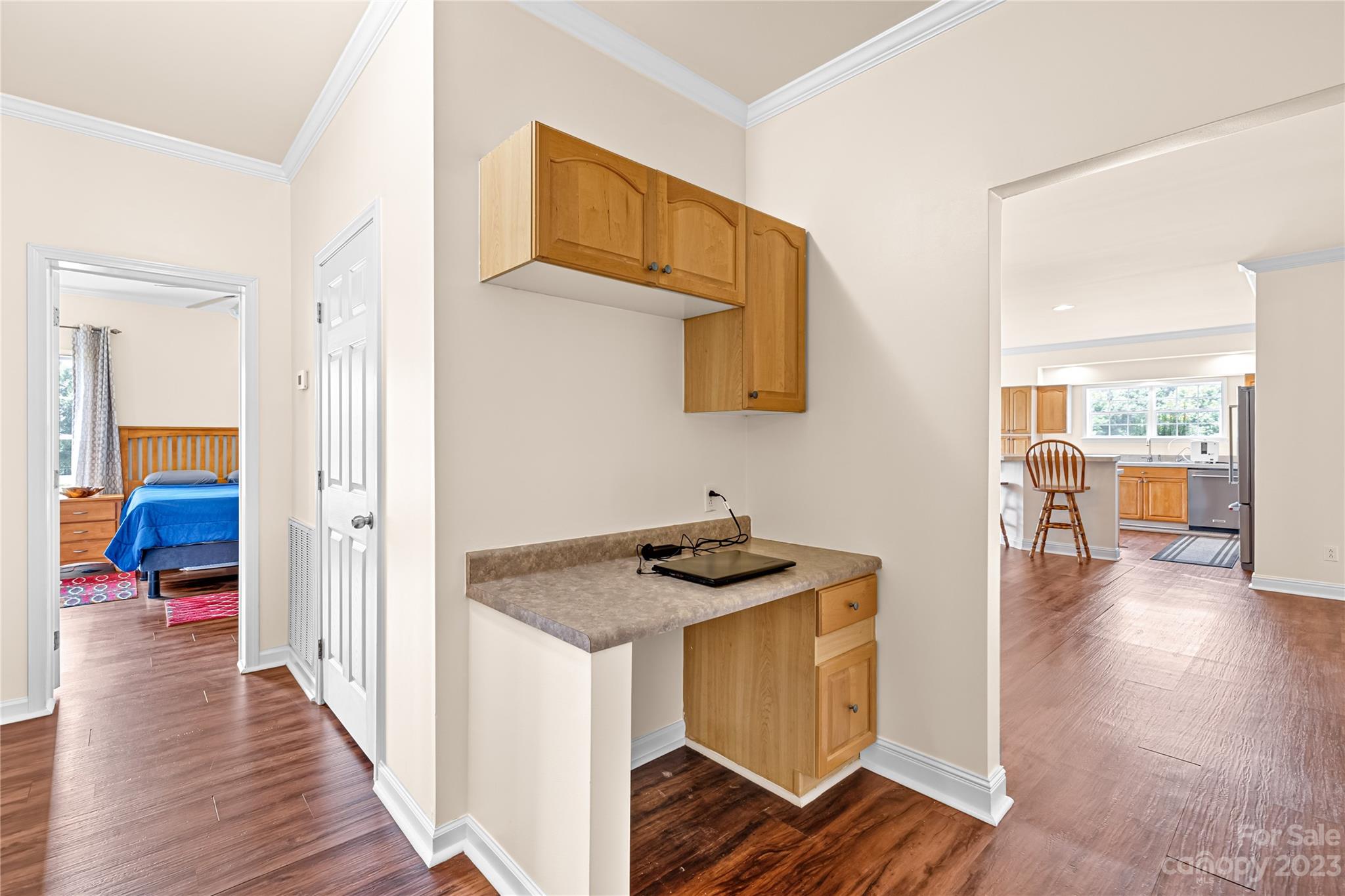 1131 Sikes Mill Road Monroe, NC 28110 - Photo 24 of 43 a view of a hallway to a livingroom with wooden floor and furniture