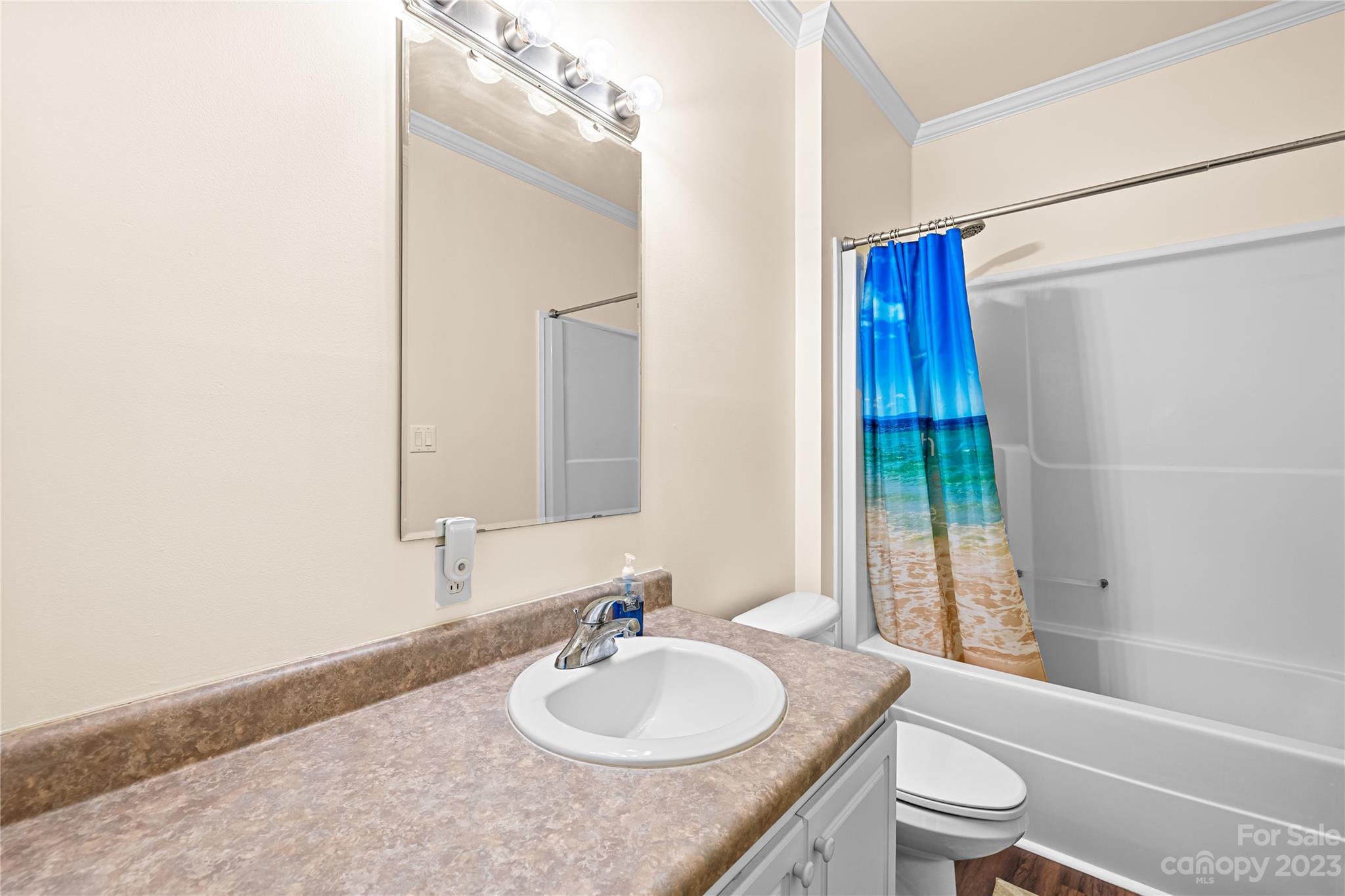 1131 Sikes Mill Road Monroe, NC 28110 - Photo 25 of 43 a bathroom with a granite countertop sink toilet and shower