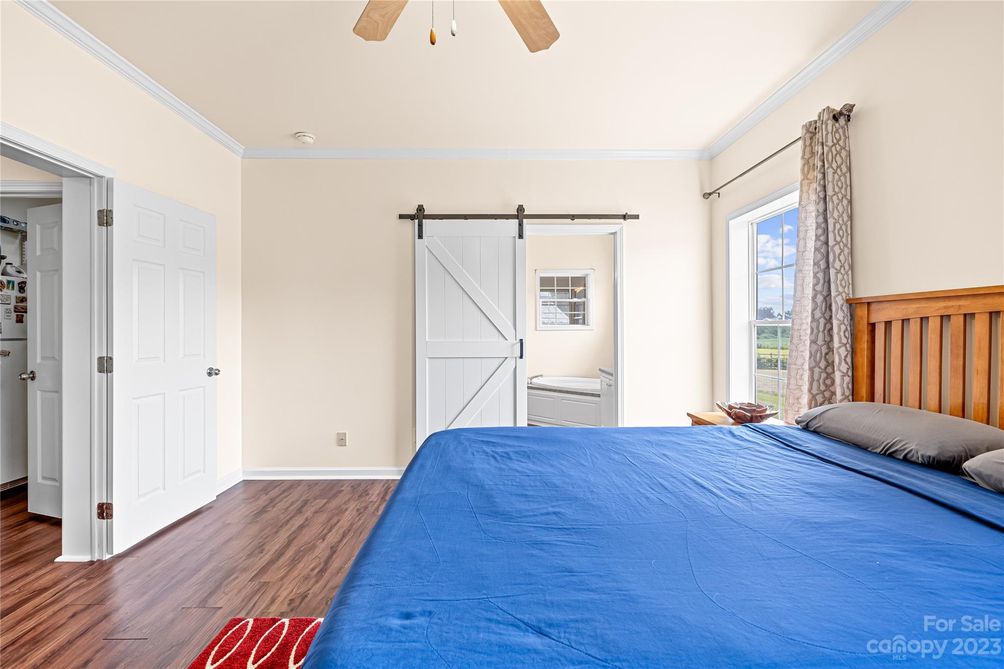 1131 Sikes Mill Road Monroe, NC 28110 - Photo 30 of 43 a view of bedroom with furniture and wooden floor