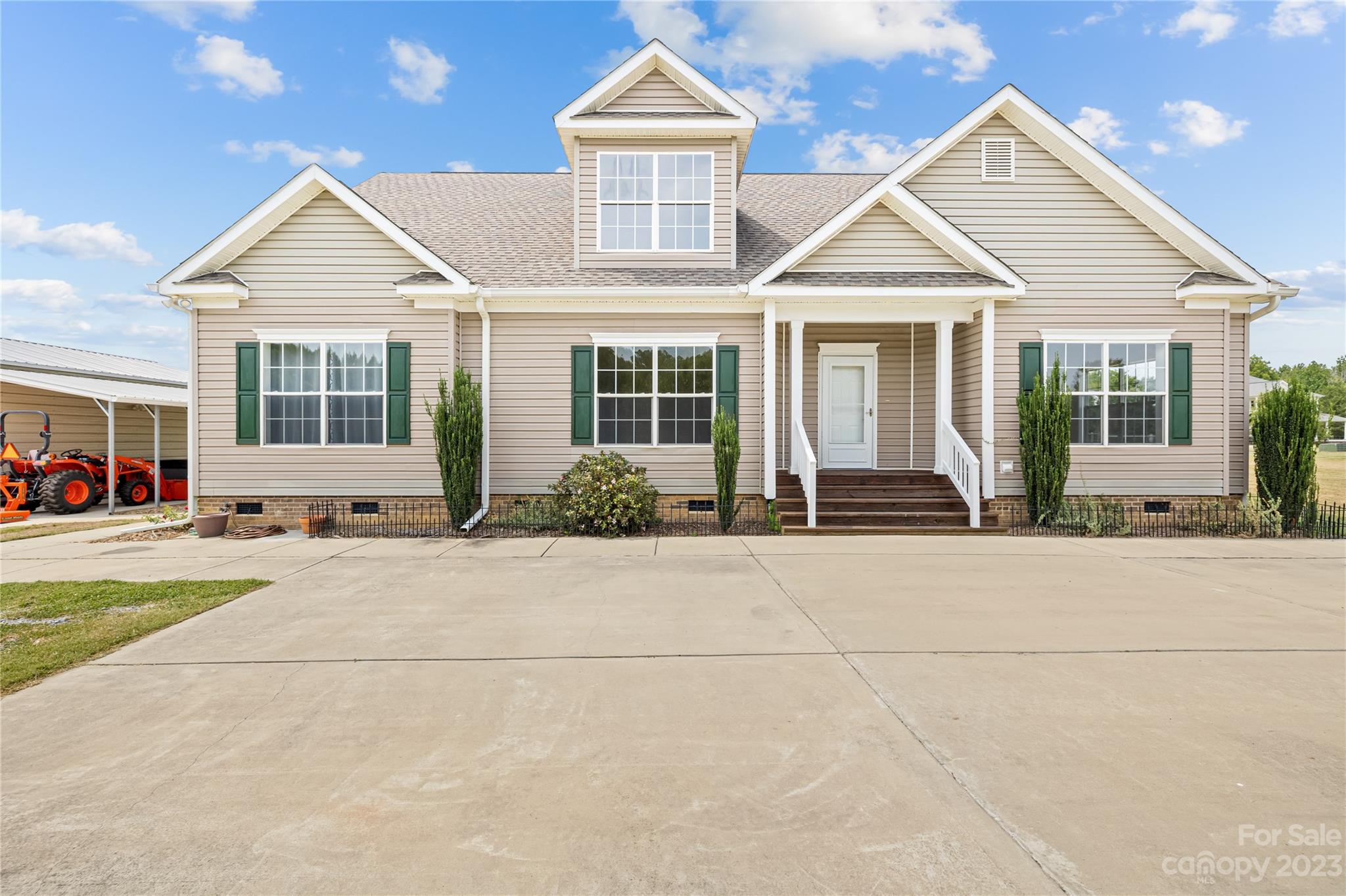 1131 Sikes Mill Road Monroe, NC 28110 - Photo 3 of 43 front view of a house with a yard
