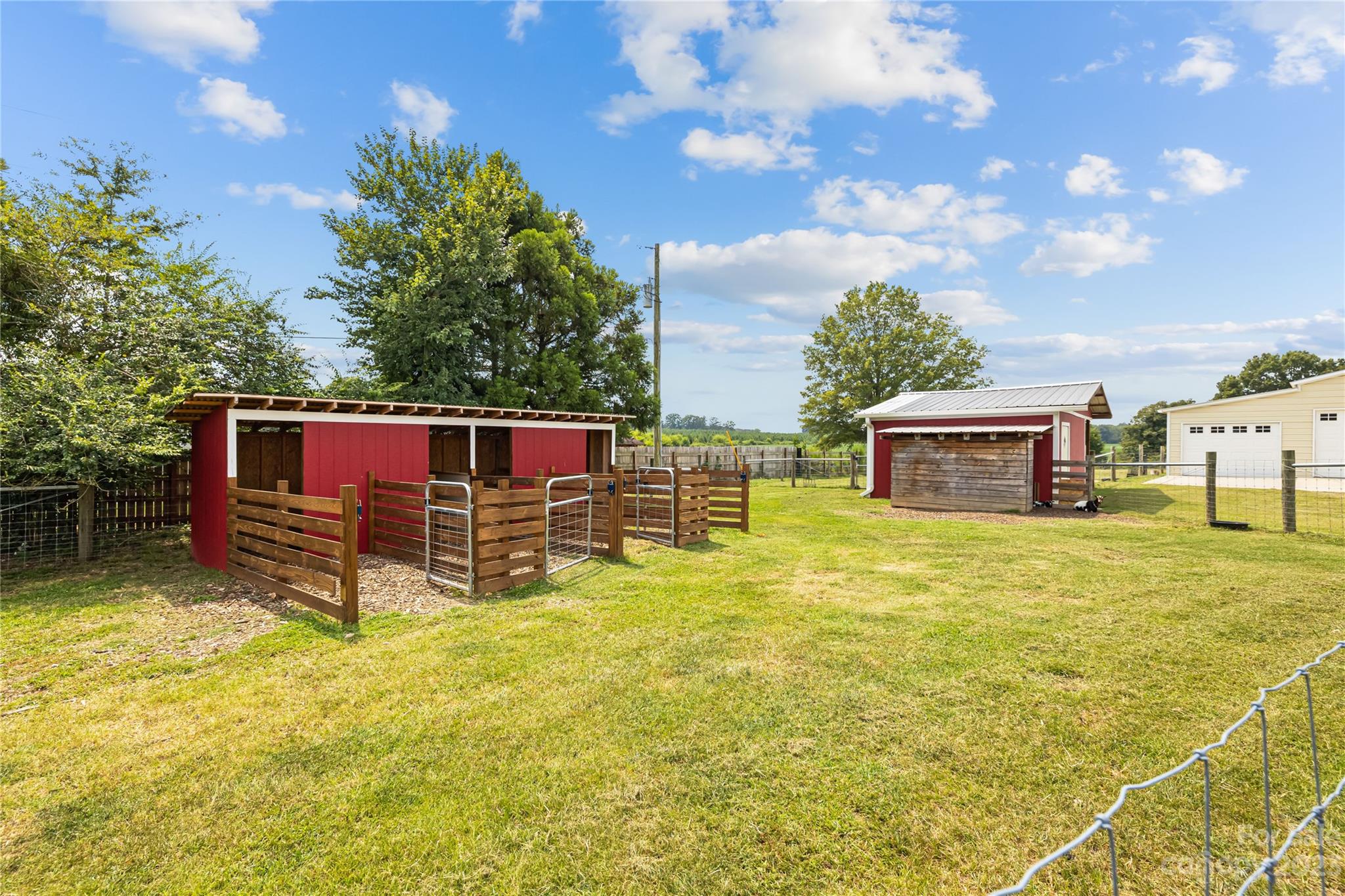 1131 Sikes Mill Road Monroe, NC 28110 - Photo 35 of 43 a view of a swimming pool with a yard
