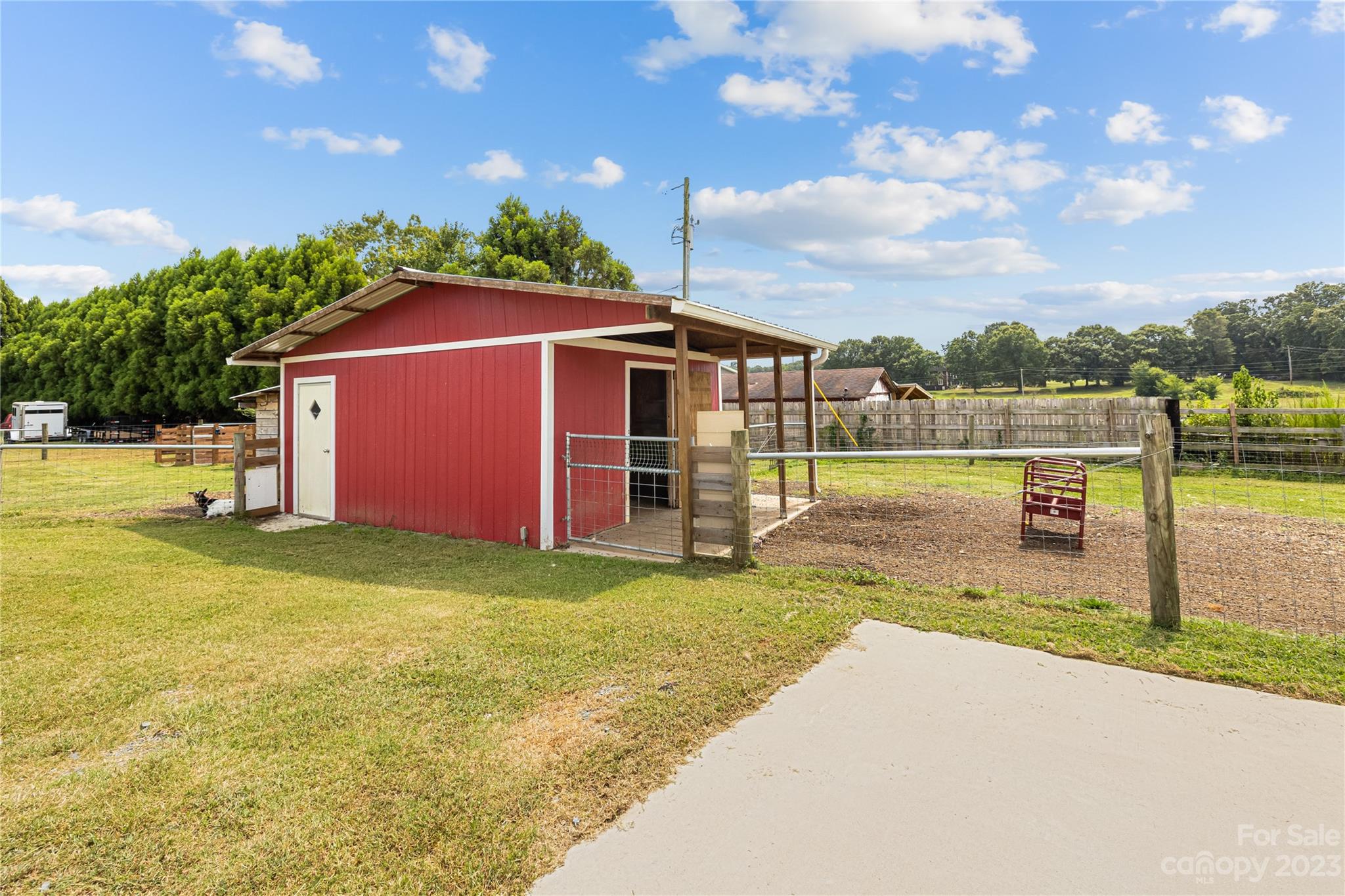 1131 Sikes Mill Road Monroe, NC 28110 - Photo 36 of 43 a view of a backyard with a garden and plants