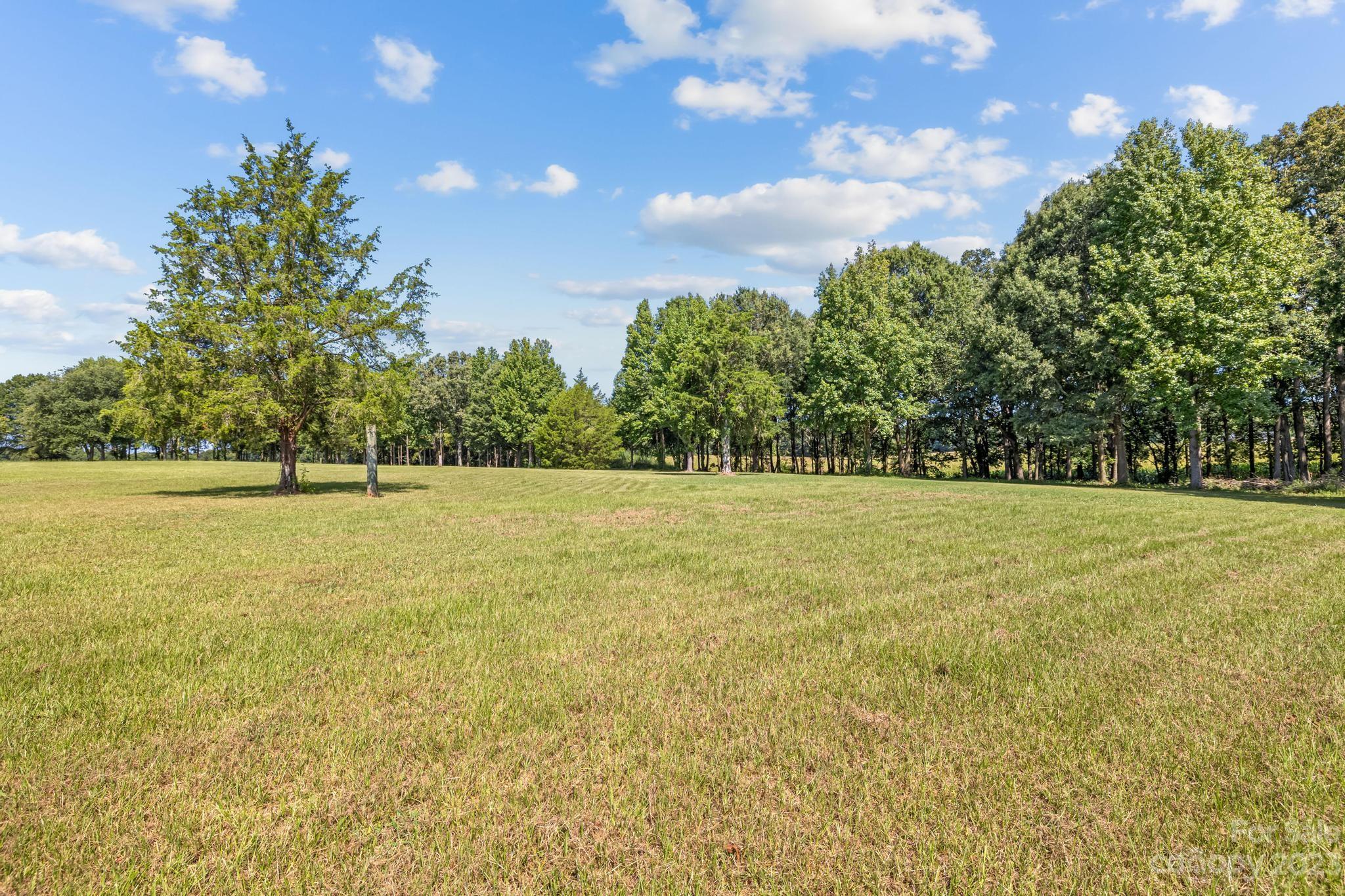 1131 Sikes Mill Road Monroe, NC 28110 - Photo 43 of 43 a view of outdoor space with yard