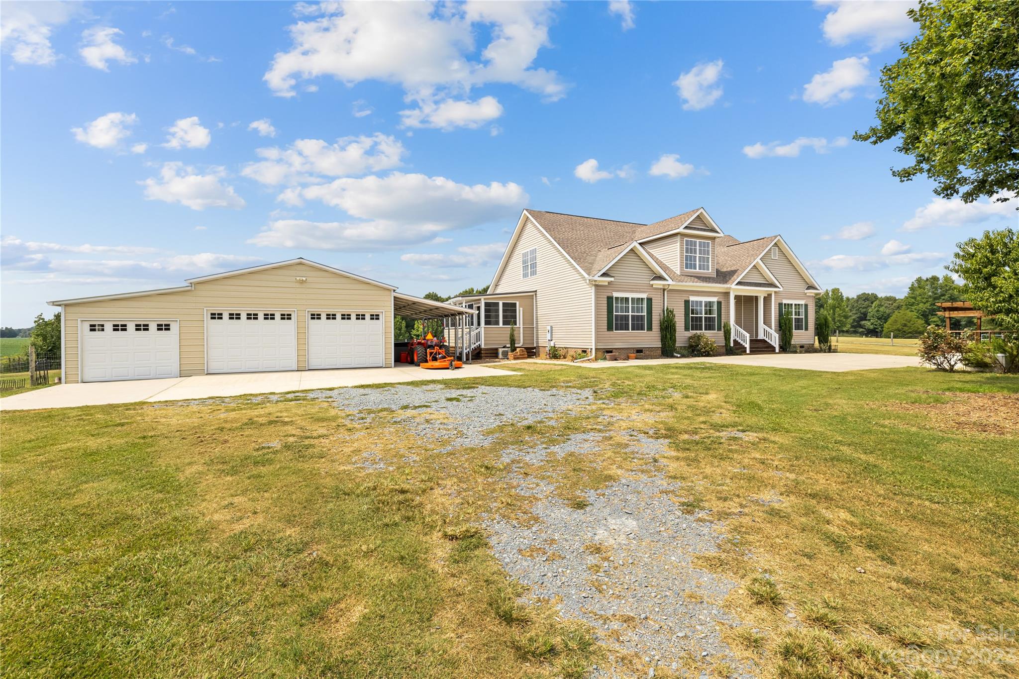 1131 Sikes Mill Road Monroe, NC 28110 - Photo 7 of 43 a front view of a building with a yard