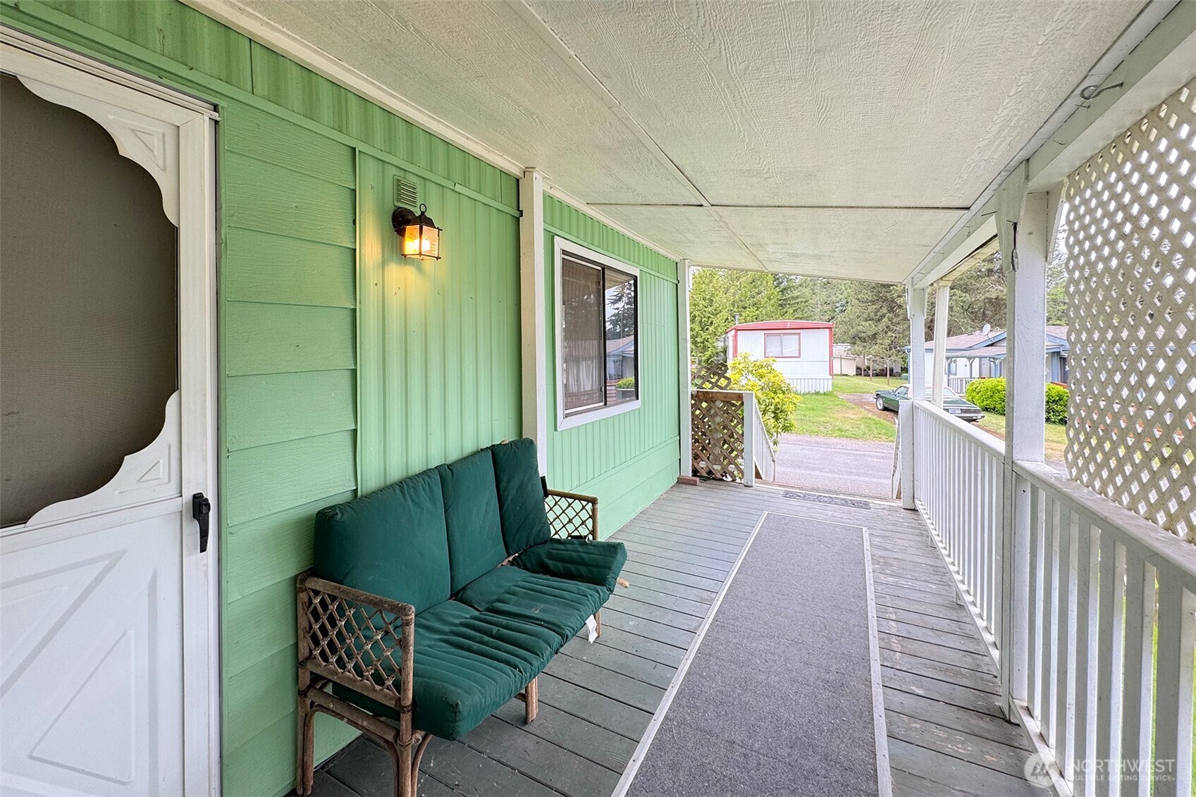 90 Baywood Village Road, Unit 34 Sequim, WA 98382 - Photo 6 of 40 a view of a balcony with furniture