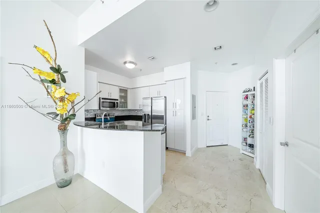 a view of a kitchen with a sink