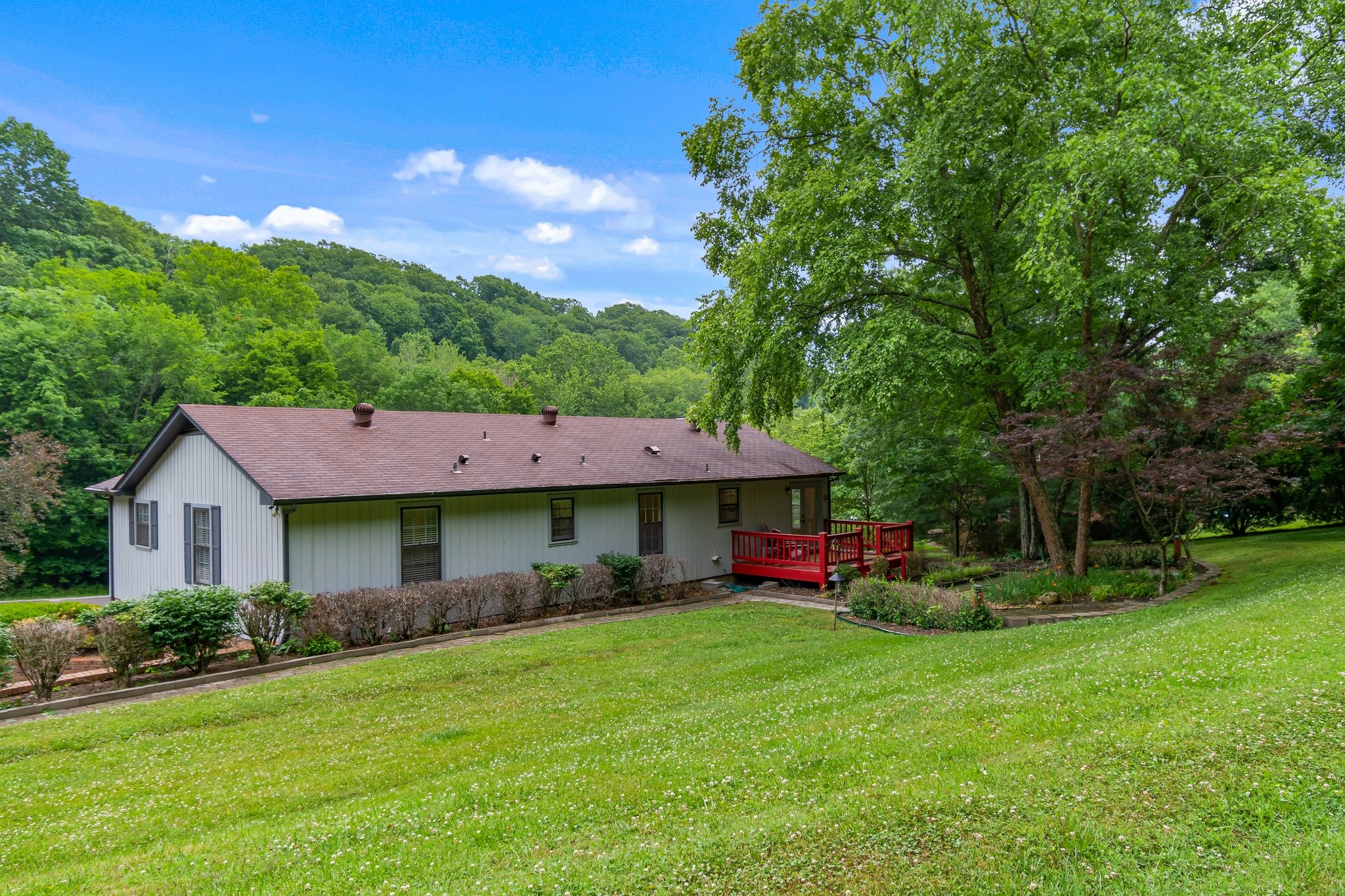 1111 Deer Lake Road Franklin, TN 37069 - Photo 6 of 53 a front view of a house with garden
