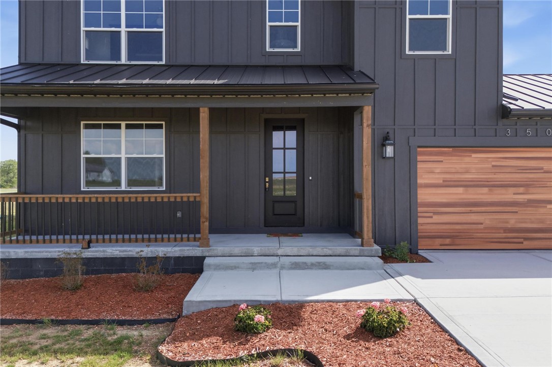 3509 South State Rte 72 Sabina, OH 45169 - Photo 3 of 44 This contemporary home boasts a inviting front porch, modern garage, and sleek exterior finishes.