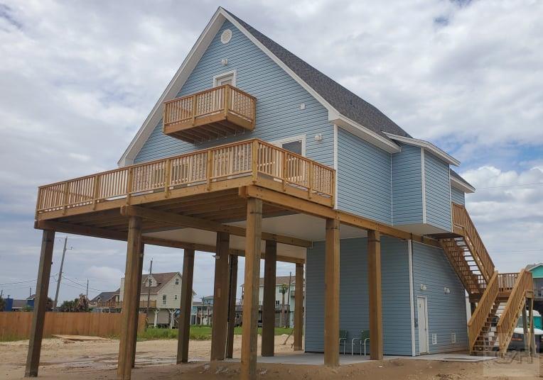 159 Doubloon Drive Freeport, TX 77541 - Photo 1 of 8 a view of a house with a balcony