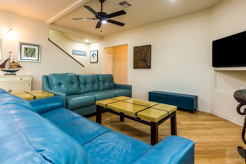 159 Doubloon Drive Freeport, TX 77541 - Photo 5 of 8 a living room with furniture and a flat screen tv