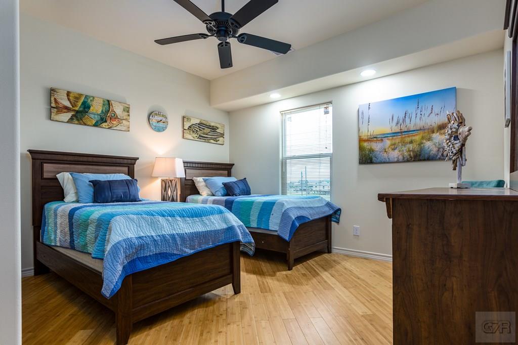 159 Doubloon Drive Freeport, TX 77541 - Photo 7 of 8 a bedroom with two beds and painting on the wall