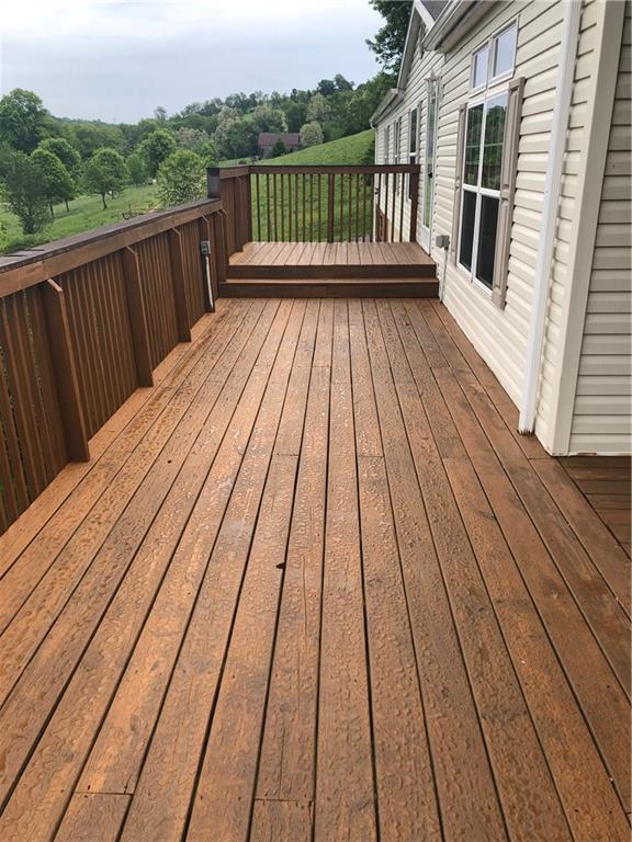 52 Willow Road Claysville, PA 15323 - Photo 17 of 25 A view of the front wrap around deck which has fresh stain on it, ready for your patio set!!!
