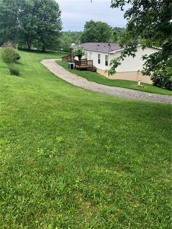 52 Willow Road Claysville, PA 15323 - Photo 20 of 25 This driveway behind the home was just recently added. But this view shows how large the yard is.