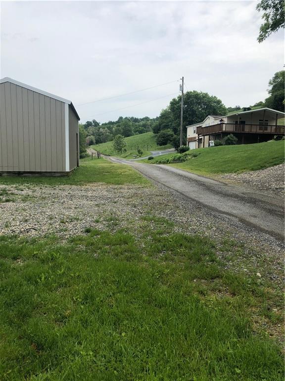 52 Willow Road Claysville, PA 15323 - Photo 23 of 25 This view shows how the property lays with the home on the upper side of the road and the detached garage below.
