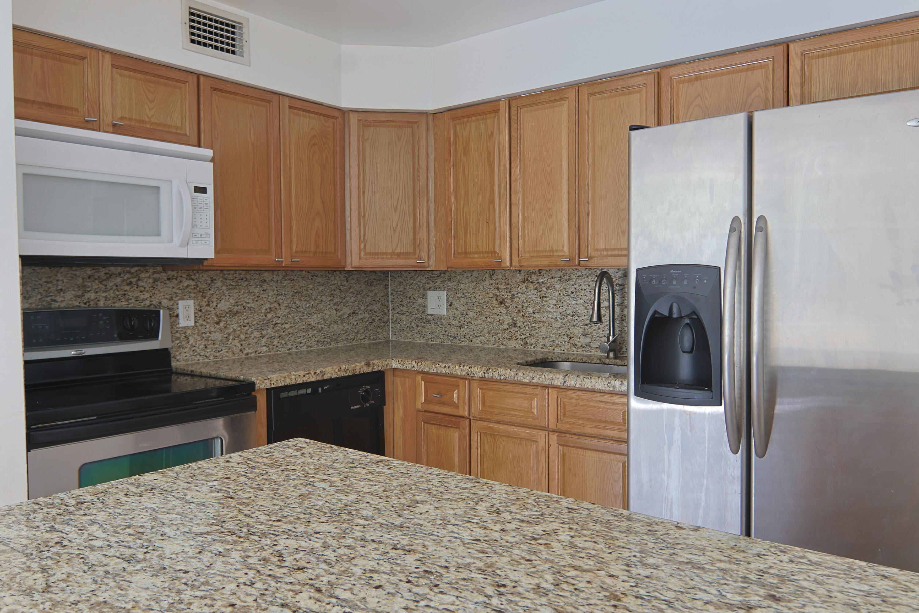 9360 Southwest 87th Avenue, Unit N8 Miami, FL 33176 - Photo 1 of 15 a kitchen with a refrigerator and a sink