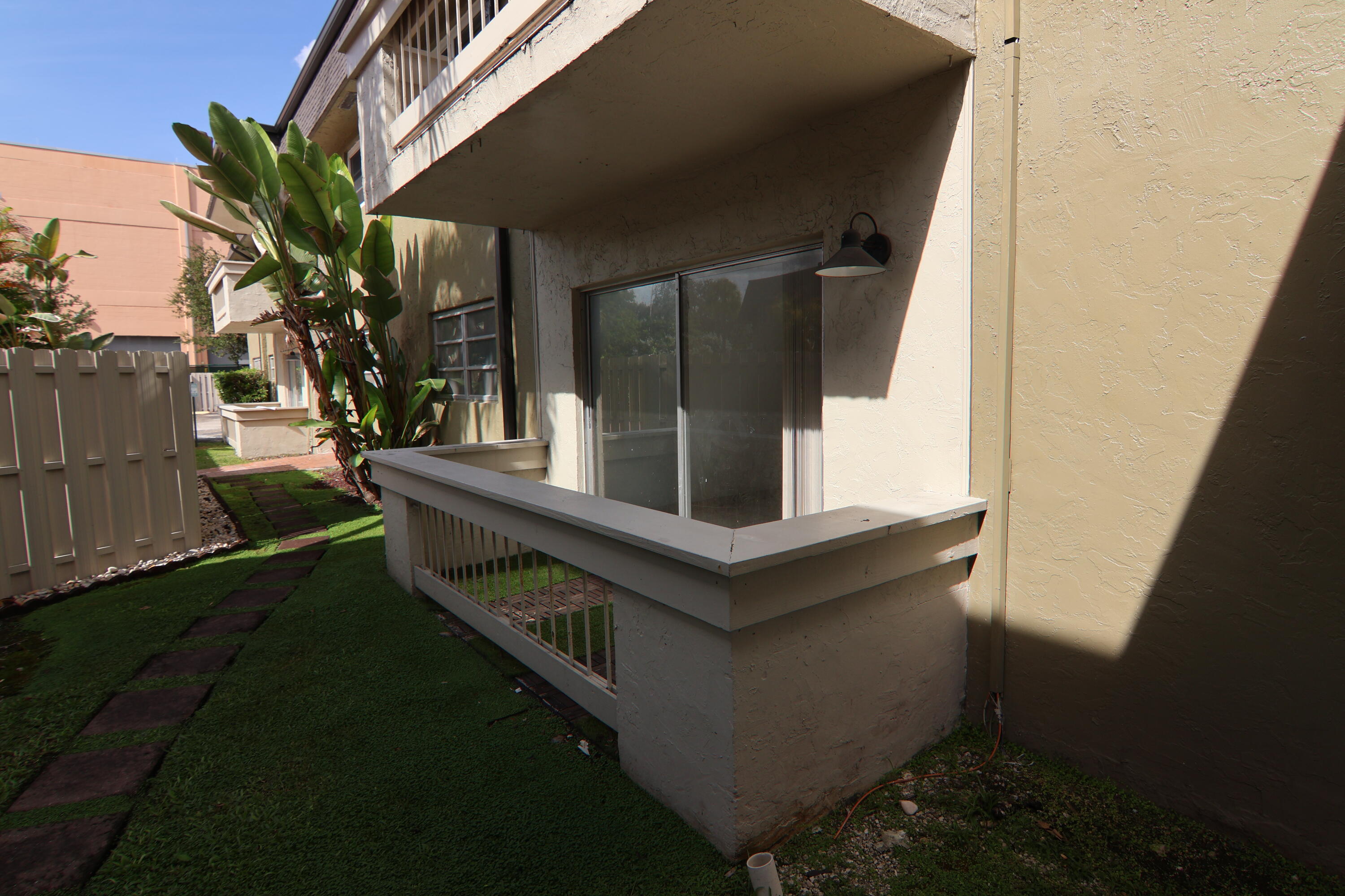 9360 Southwest 87th Avenue, Unit N8 Miami, FL 33176 - Photo 14 of 15 a view of house with yard and sitting area