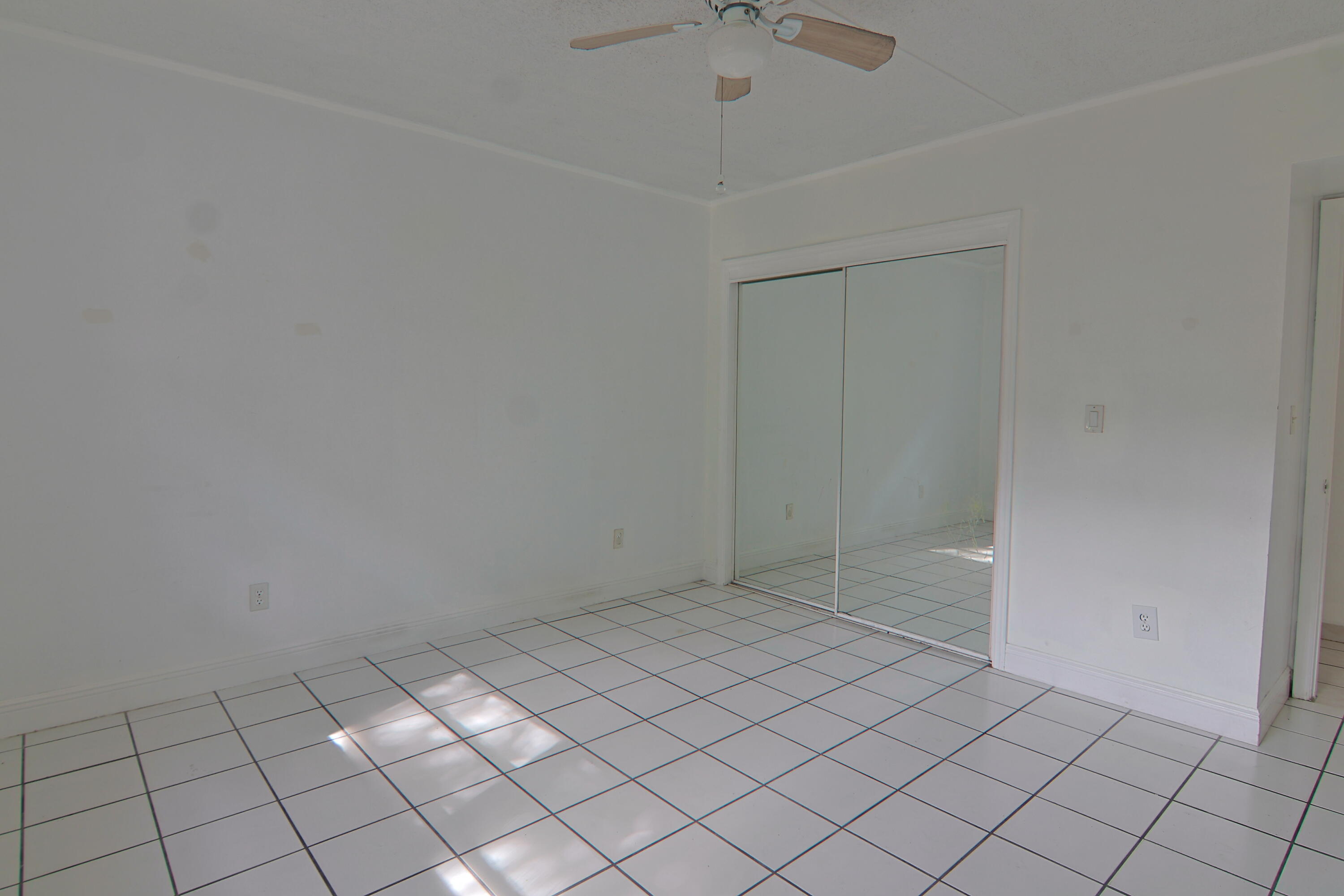 9360 Southwest 87th Avenue, Unit N8 Miami, FL 33176 - Photo 6 of 15 a view of an empty room
