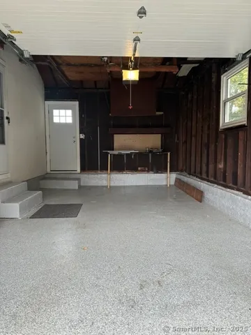 a view of an empty room with a fireplace