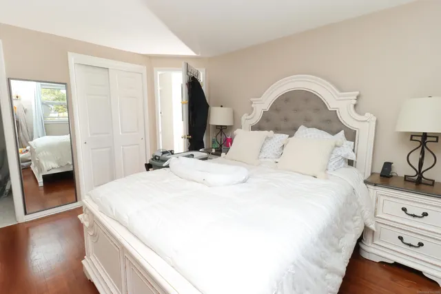 a bedroom with a bed and a fireplace