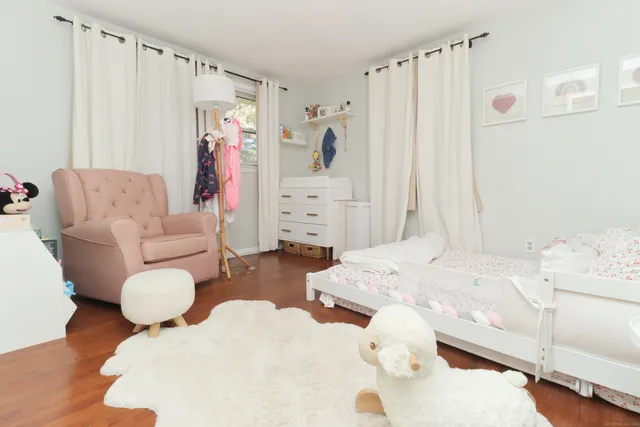 a bed room with two bed and a couch