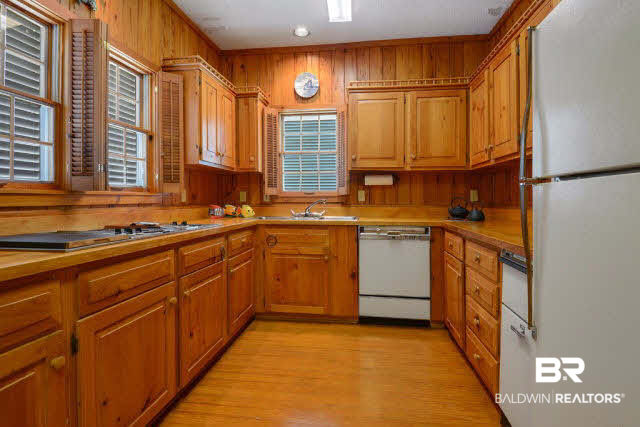 30234 River Road Orange Beach, AL 36561 - Photo 7 of 23 Lots of light in the kitchen and plenty of storage, pantry and custom wine storage