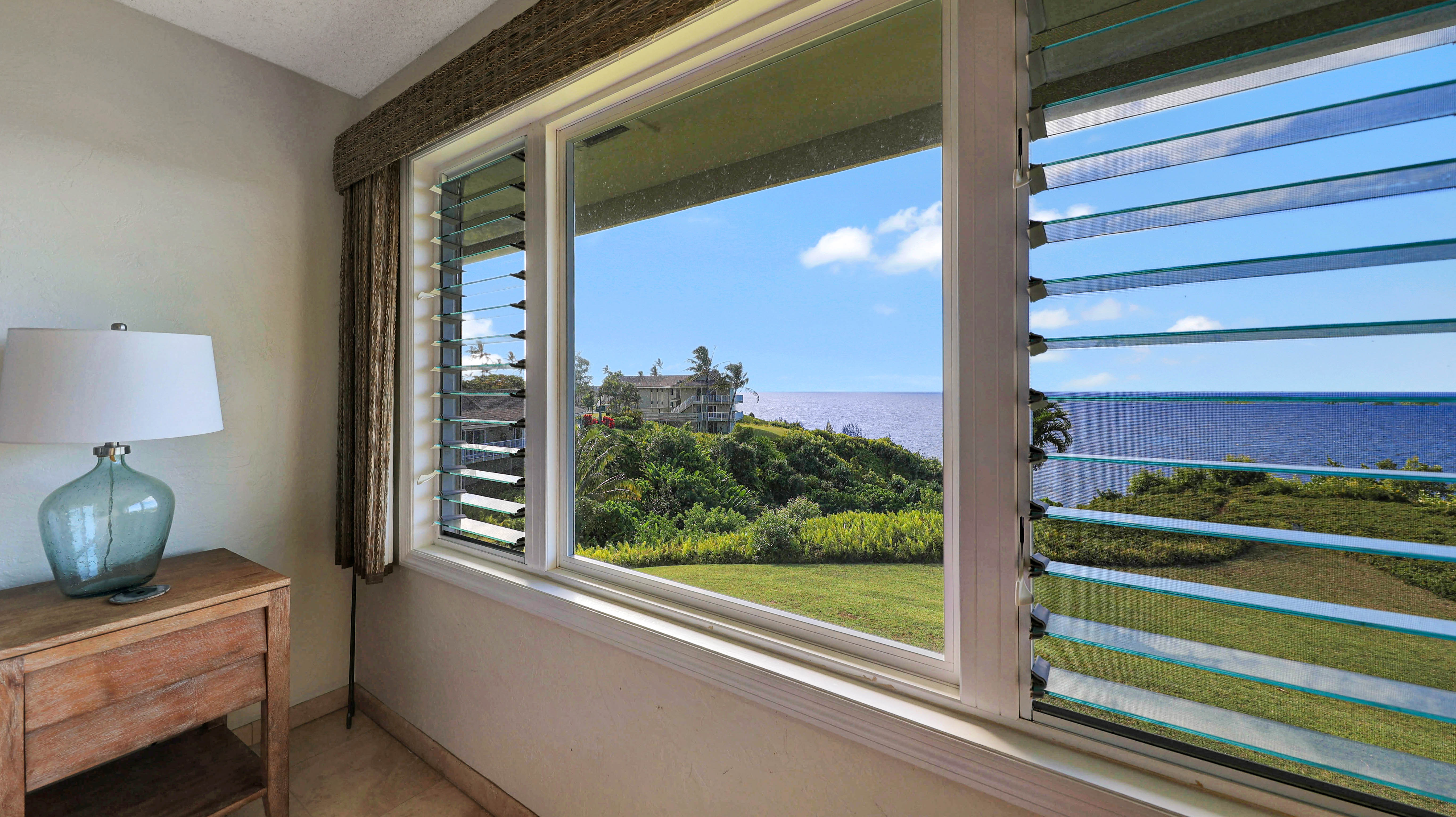 3780 Edward Road, Unit 7204 Princeville, HI 96722 - Photo 16 of 27 a view of front door and bedroom with a window