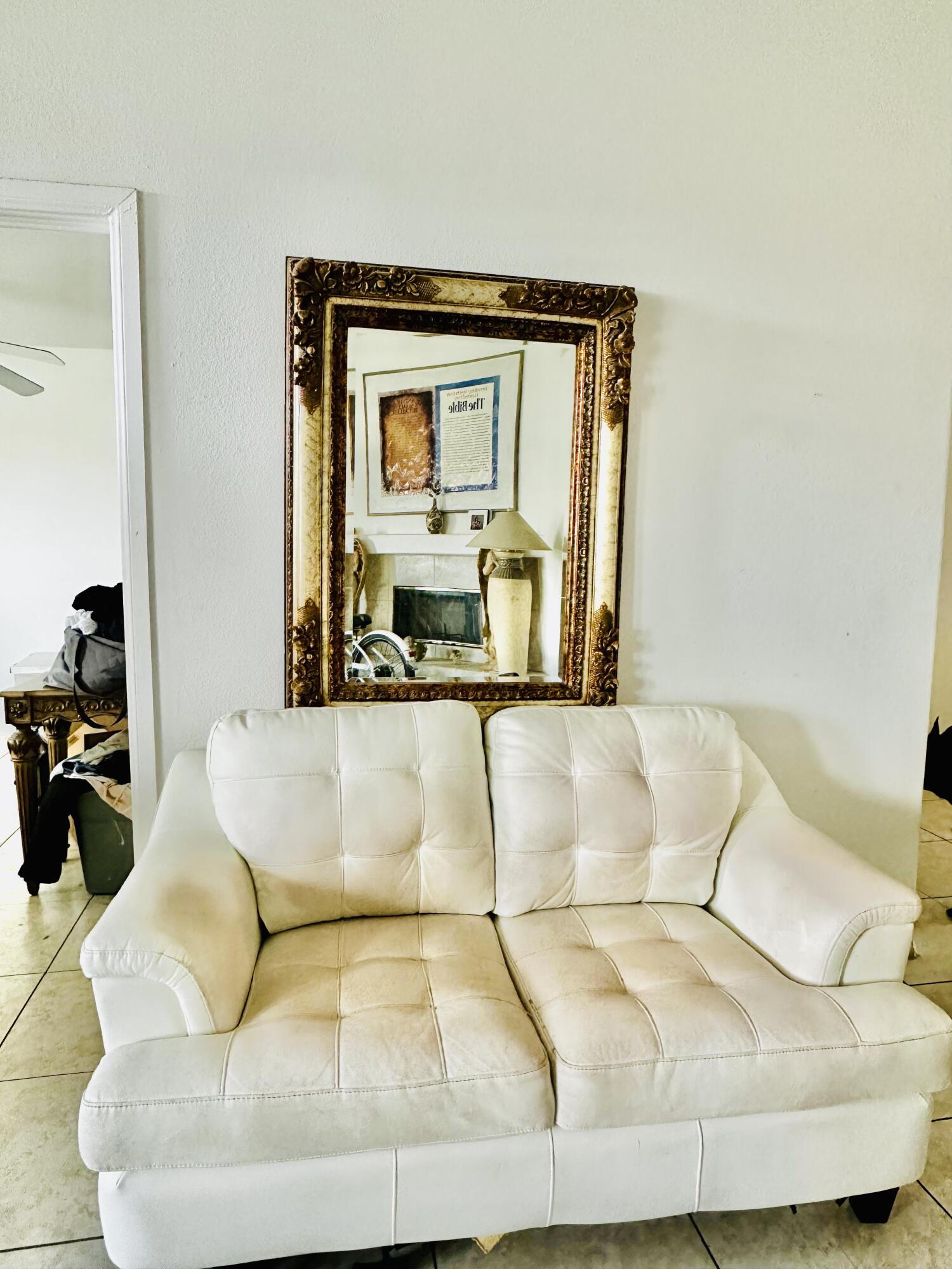 31675 Victor Road Cathedral City, CA 92234 - Photo 13 of 17 a living room with a couch and a potted plant